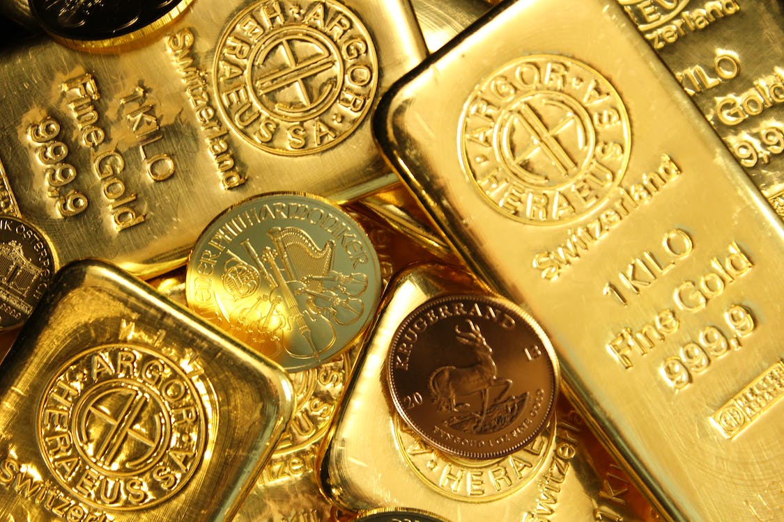 Free Close-Up Shot of Gold Bars and Coins Stock Photo